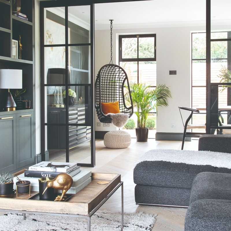 Matte Black Glass Partition with Herringbone Floors and Industrial Style
