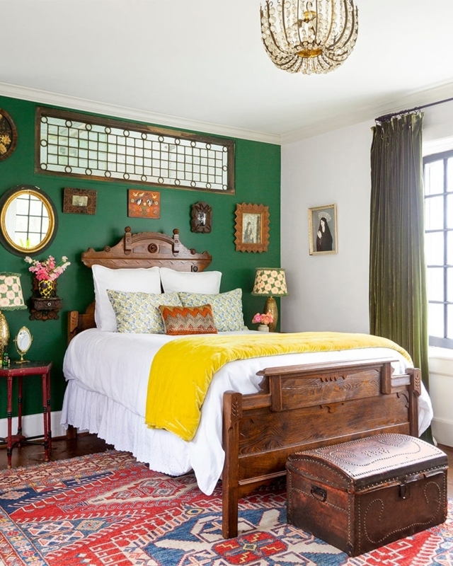 Maximalist Bedroom with Green Accent Wall and Eclectic Gallery Art