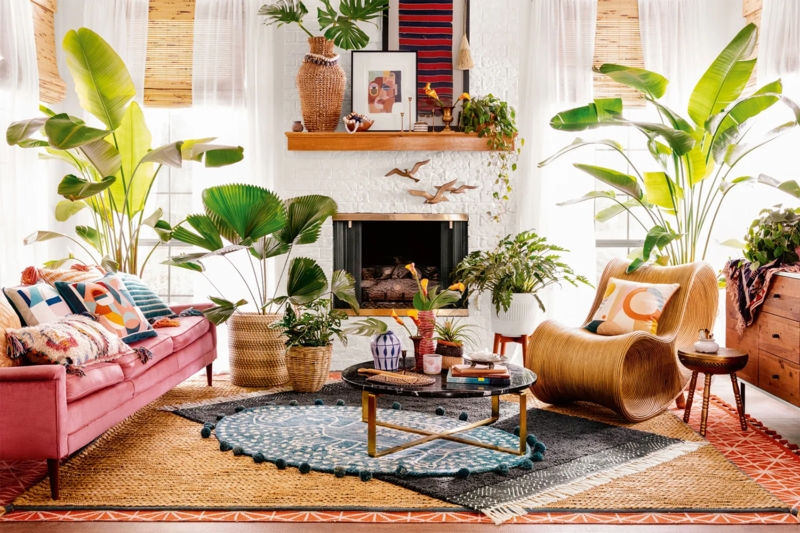Maximalist Boho Living Room With Vibrant Pink Sofa And Rattan