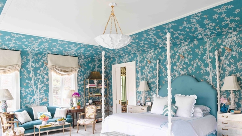 Maximalist Four Poster Bed with Carved White Posts and Teal Wallpaper