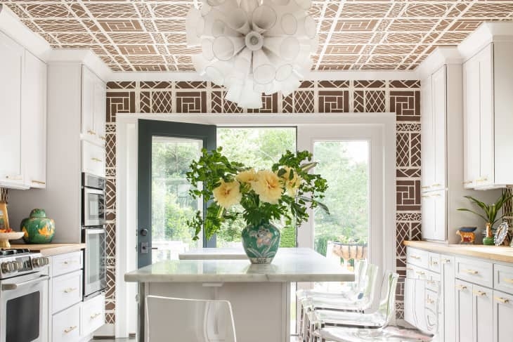 Maximalist Kitchen with Geometric Wallpaper Ceiling and Spiky Pendant Light