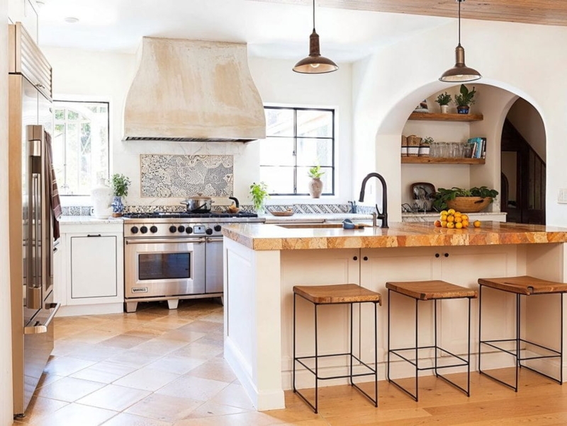 Mediterranean Kitchen with Custom Plaster Range Hood and Arched Niche