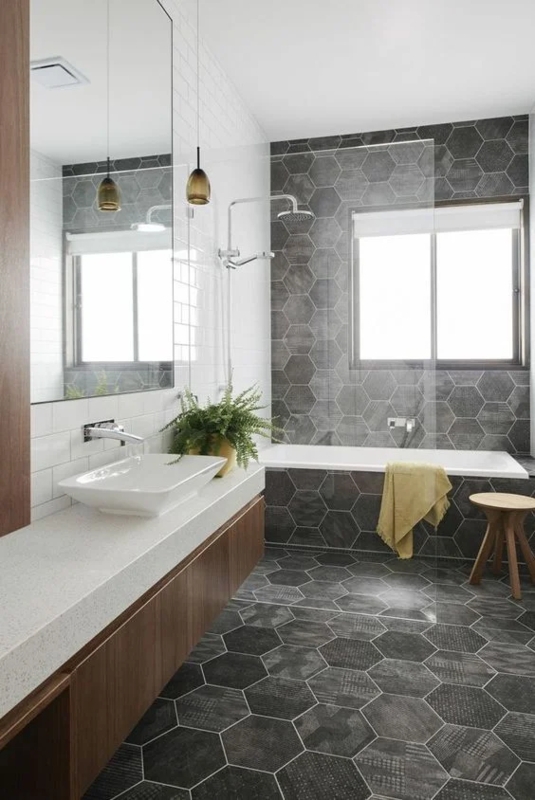Minimalist Bathroom with Hexagonal Accent Wall and Floating Wood Vanity
