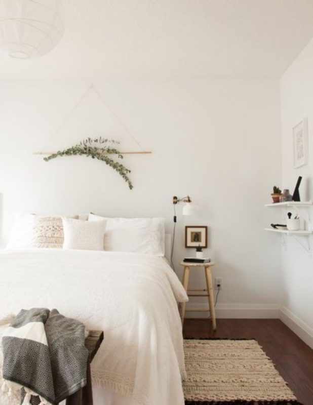 Minimalist Bedroom with Eucalyptus Wall Hanging and Stool Nightstand