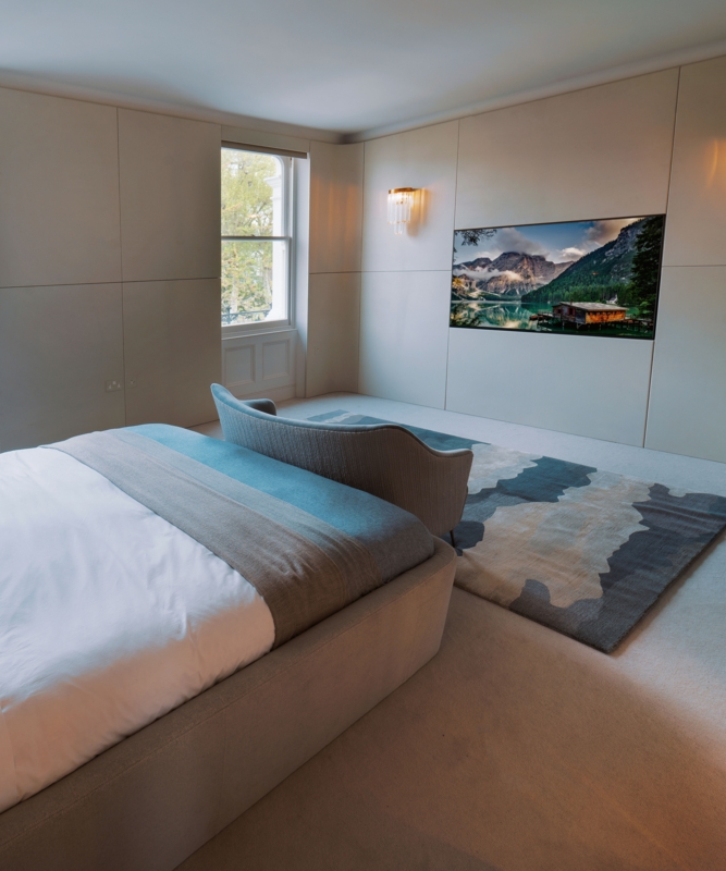 Minimalist Bedroom with Integrated Wall Panels and Curved Bench Layout
