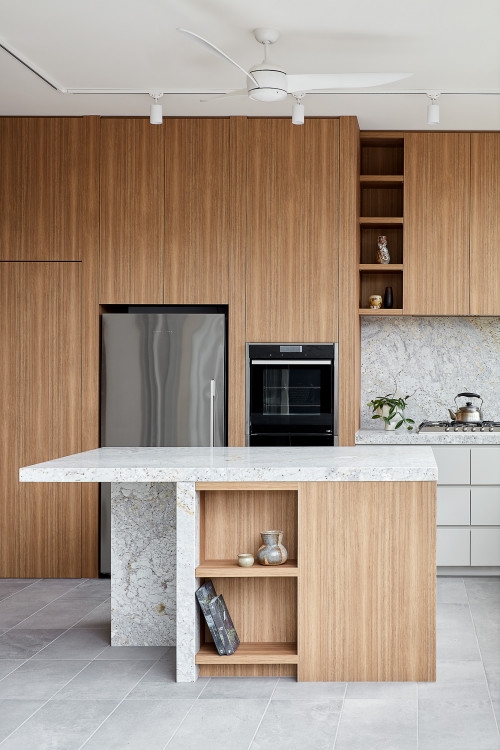 Minimalist Black Island with Seating and Light Oak Cabinetry