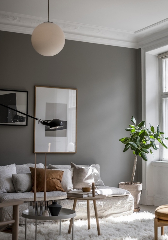Minimalist Charcoal Living Room with Shaggy White Rug and Globe Light
