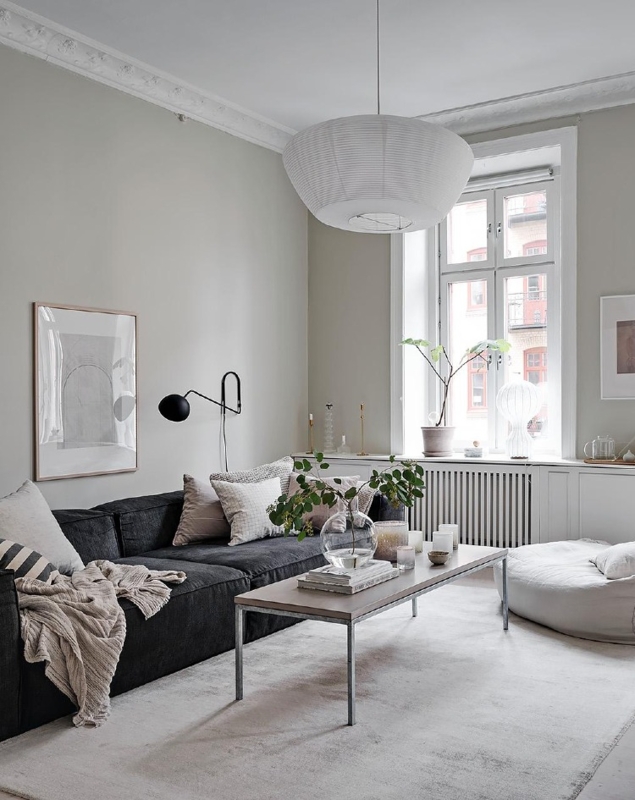 Minimalist Charcoal Sectional Styling with Oversized Paper Pendant