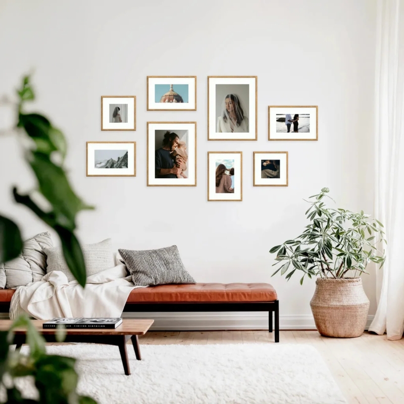 Minimalist Living Room Daybed With Organic Gallery Wall Layout In Wood Frames