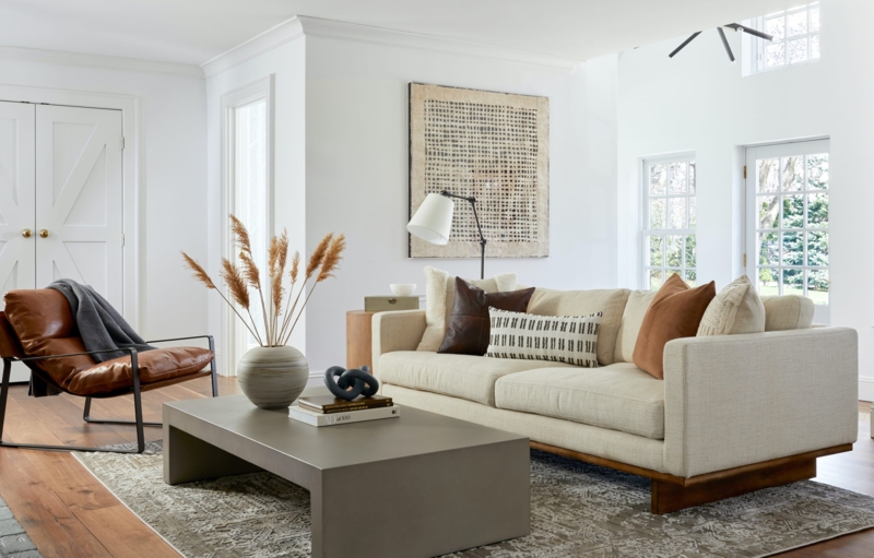 Minimalist Living Room featuring Grey Block Coffee Table and Leather Chair