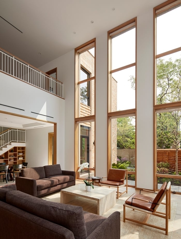 Minimalist Living Room with Mezzanine and Double Height Windows