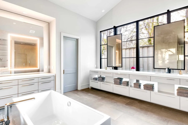 Minimalist Master Bath with Black Frame Windows and Suspended Mirrors