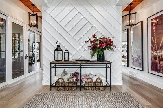 Minimalist Metal Console Table with Geometric Wood Accent Wall Ideas