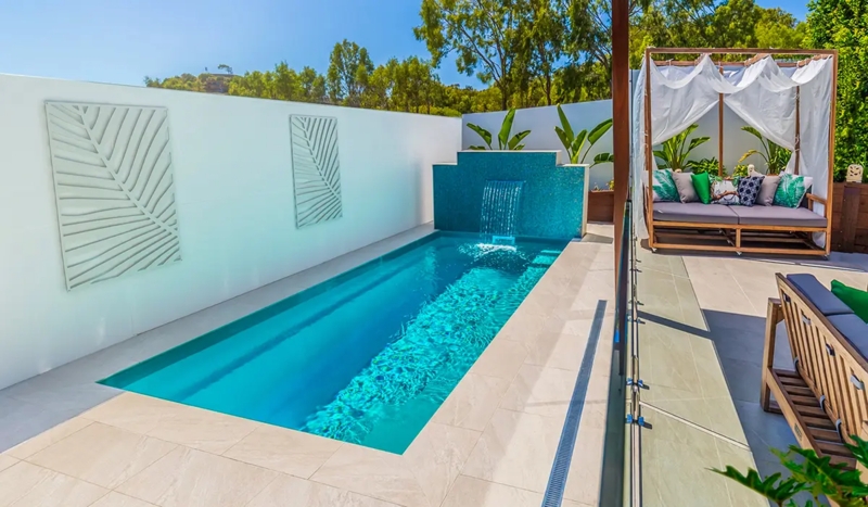 Minimalist Narrow Lap Pool with Waterfall Spillway