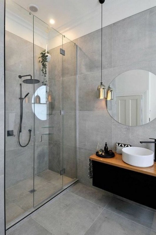 Minimalist Small Bathroom with Large Format Grey Tiles and Round Mirror