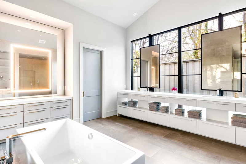 Minimalist White Master Bathroom: Backlit Mirrors & Black Windows