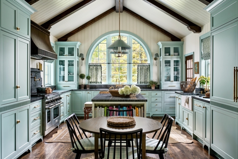 Mint Green Cottage Kitchen with Arched Window and Vaulted Ceiling.