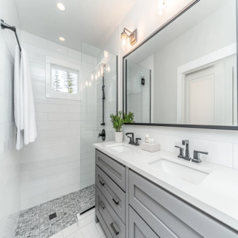 Modern Bathroom featuring Curbless Shower, Mosaic Floor, and Black Hardware