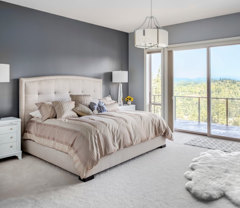Modern Bedroom with Beige Upholstered Bed and Charcoal Accent Wall