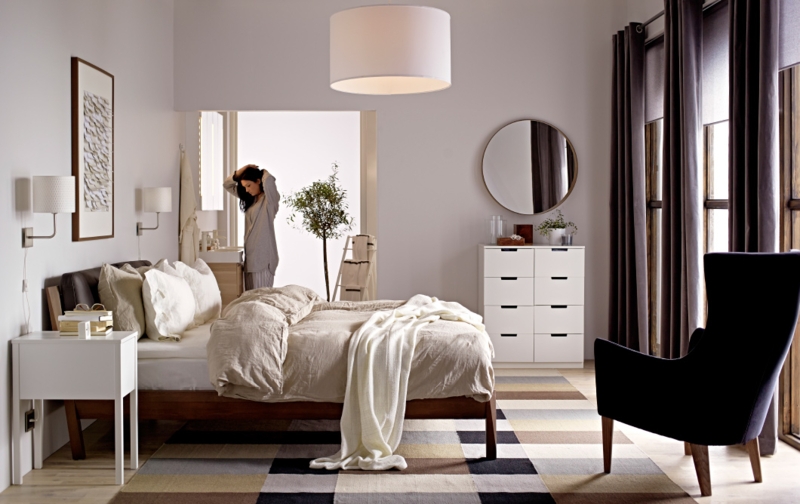 Modern Bedroom with Geometric Block Rug and Dark Wingback Chair