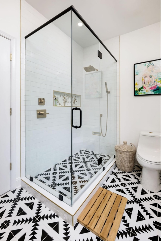 Modern Bohemian Walk-In Shower: Black Frame & Geometric Floor Tiles
