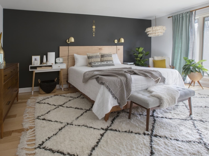 Modern Boho Platform Bed Against Dark Charcoal Accent Wall Bedroom