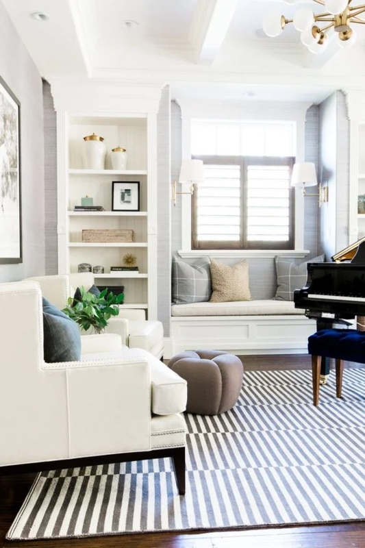 Modern Brass Chandelier Design with Bold Striped Rug