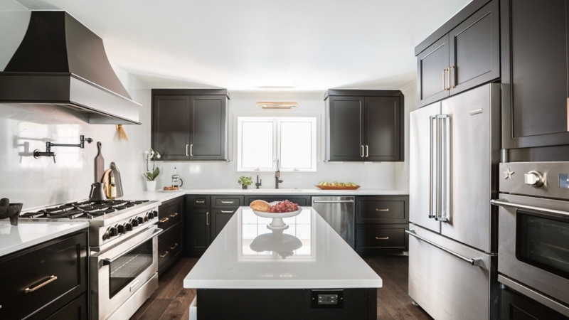 Modern Charcoal Kitchen Cabinets with White Quartz Island.