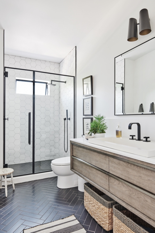 Modern Coastal Floating Vanity with Black Herringbone Floor Tiles