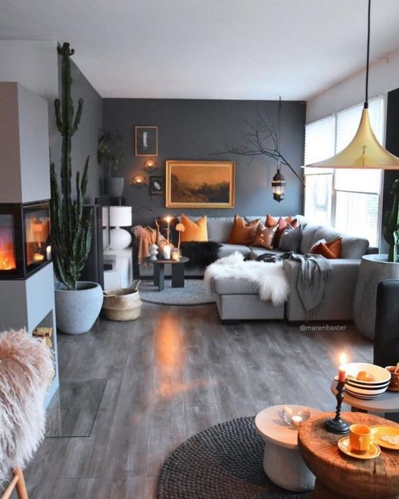 Modern Eclectic Living Room with Oversized Cactus and Dark Accent Wall