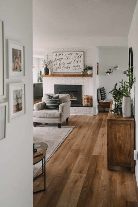 Modern Farmhouse Accent Chair White Brick Fireplace Natural Wood Mantel