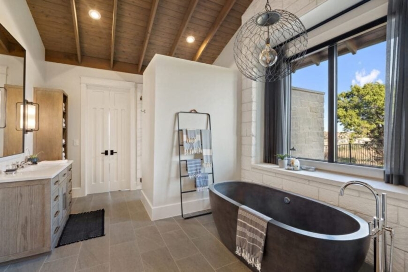 Modern Farmhouse Bathroom: Charcoal Tub & Beamed Ceiling