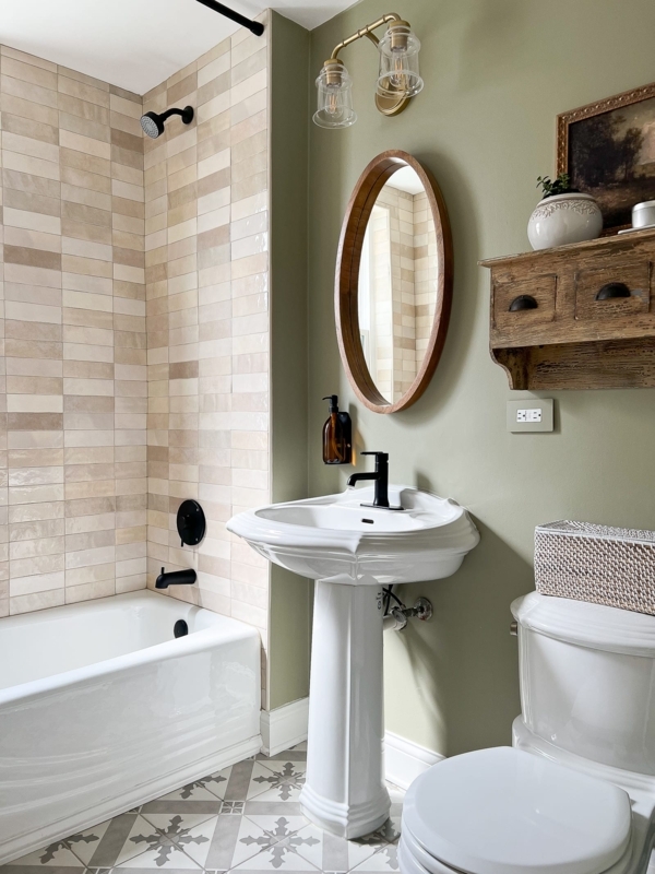 Modern Farmhouse Bathroom: Sage Green Walls and Patterned Tile Floor