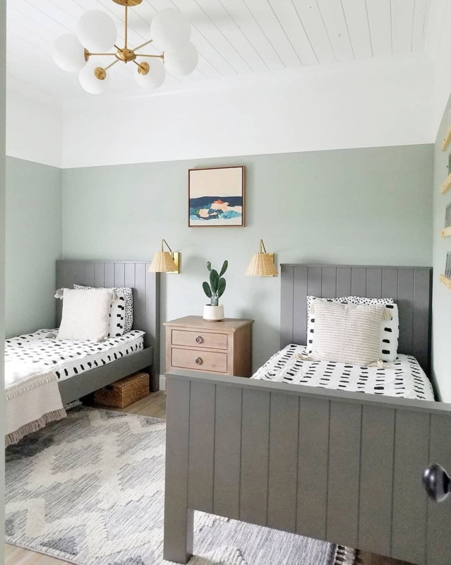 Modern Farmhouse Kids Room with Sage Green Two-Tone Walls and Gray Beds