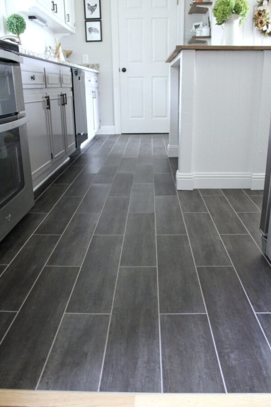 Modern Farmhouse Kitchen with Dark Grey Plank Flooring and White Cabinets