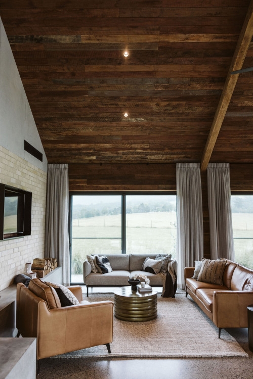 Modern Farmhouse Living Room with Vaulted Wood Ceiling and Brass Table