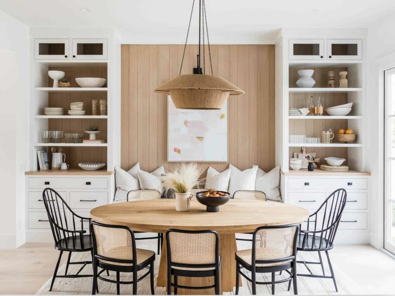 Modern Farmhouse Nook: Vertical Wood Paneling & Black Cane Back Chairs