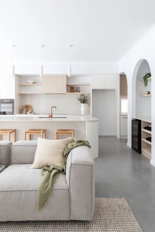 Modern Grey Concrete Floor Living Room with Ribbed Island & Arches