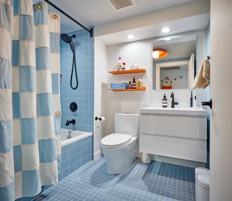 Modern Kids Bathroom with Grid Tile Floor and Orange Floating Shelves