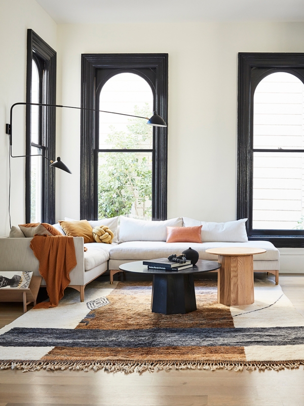 Modern Living Room with Arched Windows and Black Window Trim Design