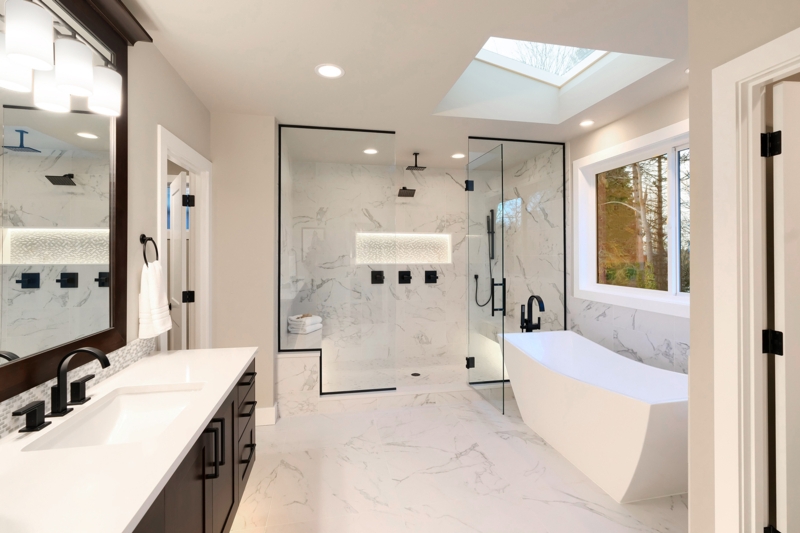 Modern Master Bathroom with Skylight, Marble Tile & Black Fixtures