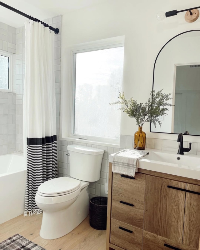 Modern Minimalist Bathroom with wood vanity and vertical stack bond tile.