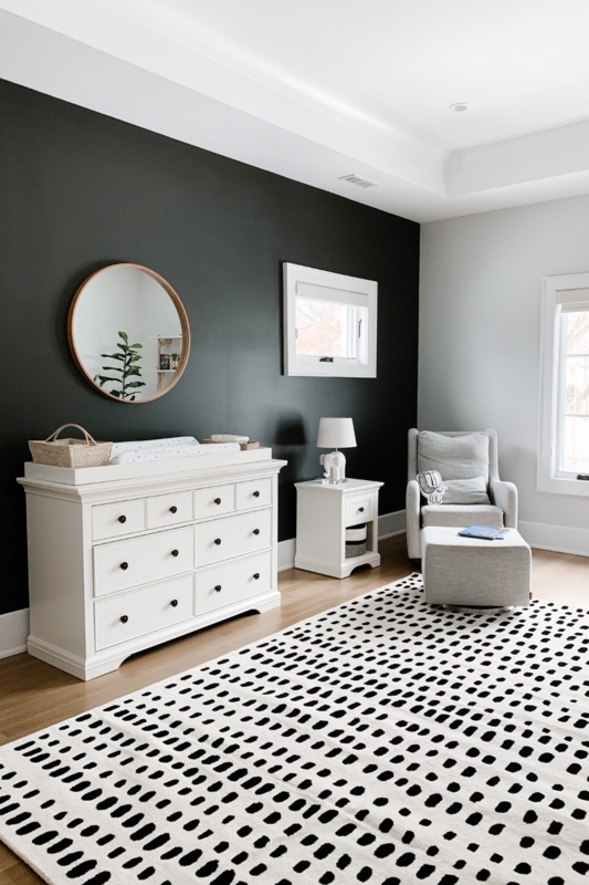 Modern Monochrome Nursery: Matte Black Accent Wall & White Dresser