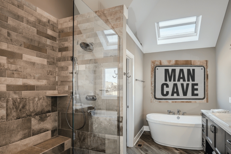 Modern Rustic Bathroom Design with Skylight and Varied Stone Tile