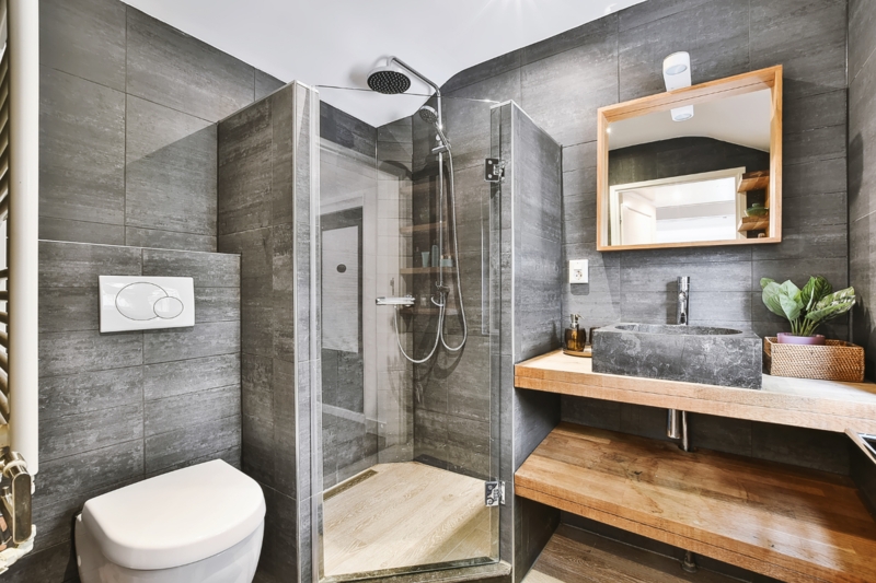 Modern Small Bathroom with Stone Vessel Sink and Floating Wood Shelves