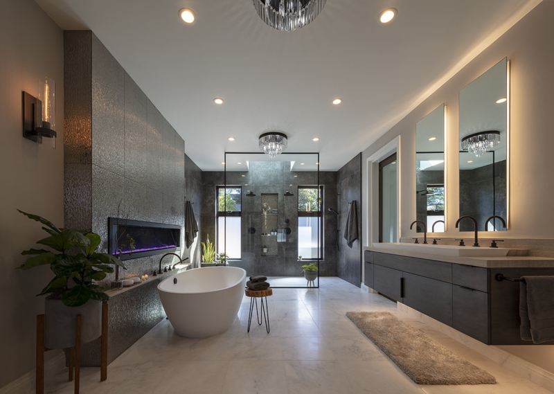 Modern Spa Bathroom Fireplace with Textured Wall and Tub