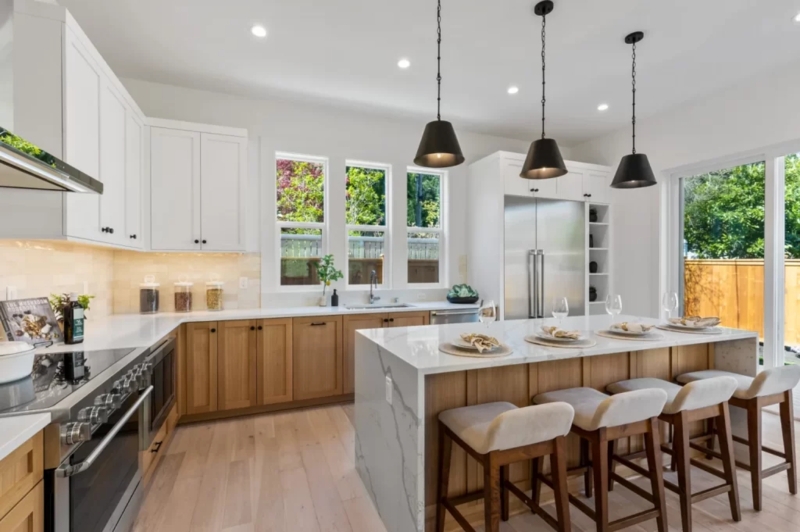 Modern Waterfall Island Kitchen with Two-Tone Cabinet Design