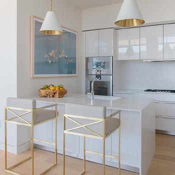 Modern White Kitchen with Gold Geometric Counter Stools and Cone Pendants