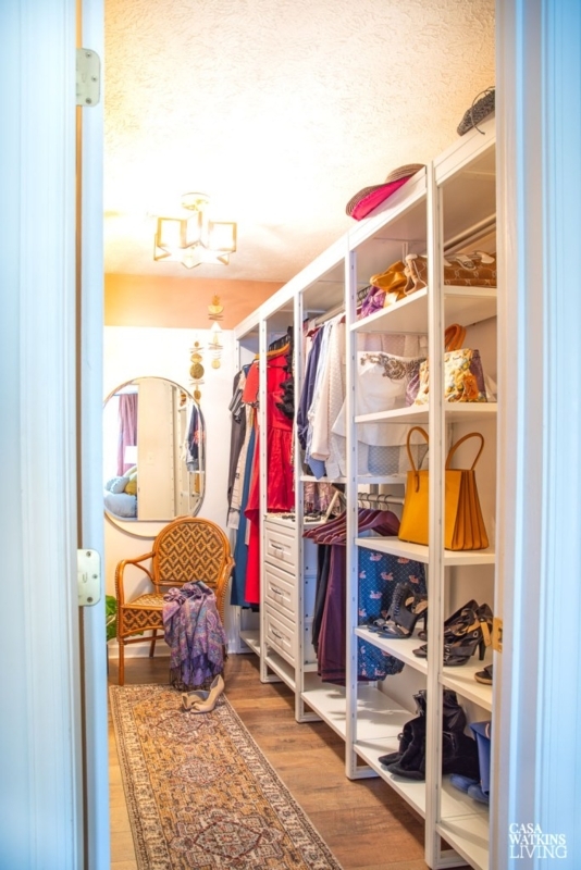 Modular Shelving System with Woven Accent Chair and Patterned Rug