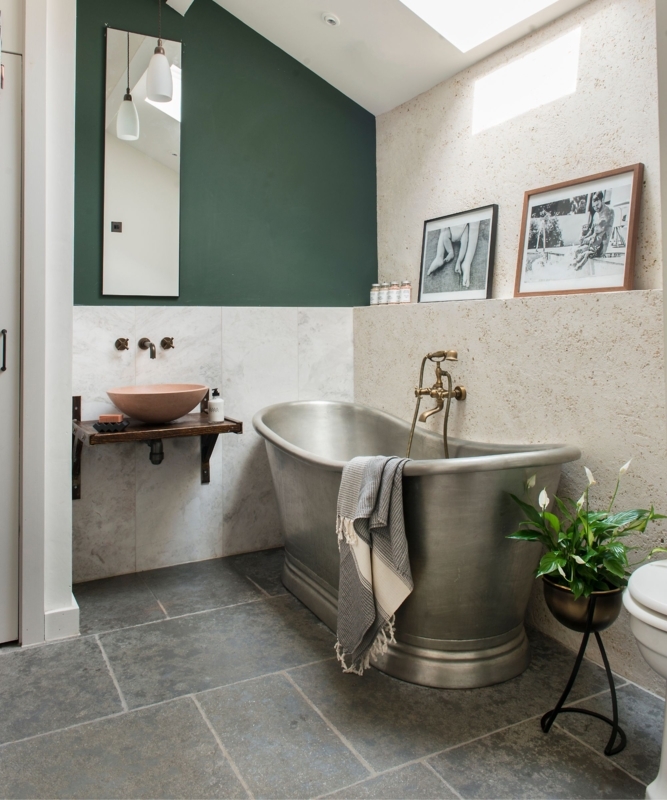 Moody Bathroom Design: Metallic Bathtub and Forest Green Accent Wall